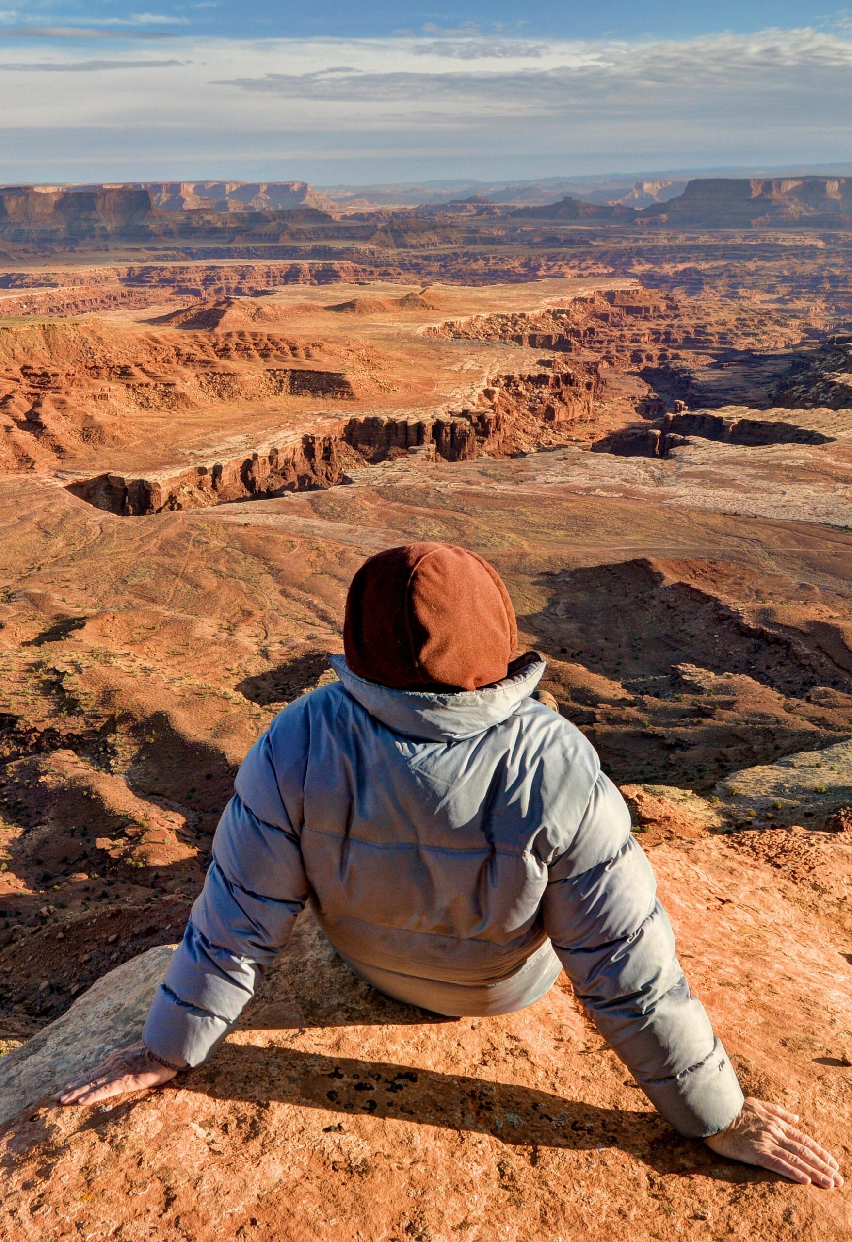 USA, Utah, Canyonlands National Park, Hiker looking at Buck Canyon Moab Chamber of Commerce, Moab Utah, Grand County UT